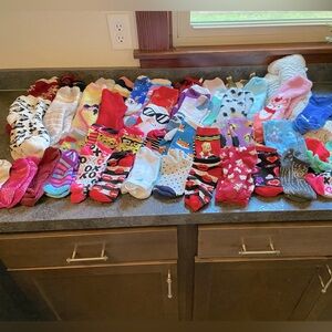 47 pairs of gently used socks. Fuzzy socks, novelty socks, name brand socks